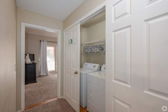 A laundry room with a washer and dryer.