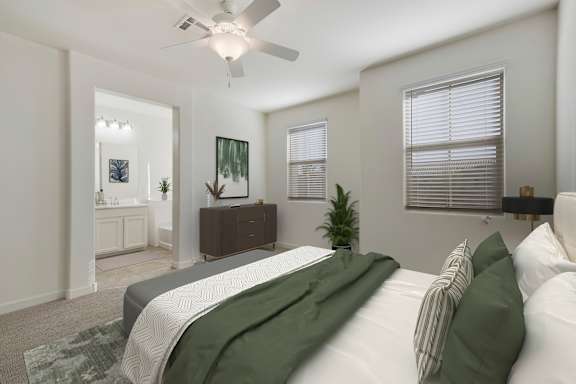A bedroom with a bed, a dresser, and a ceiling fan.