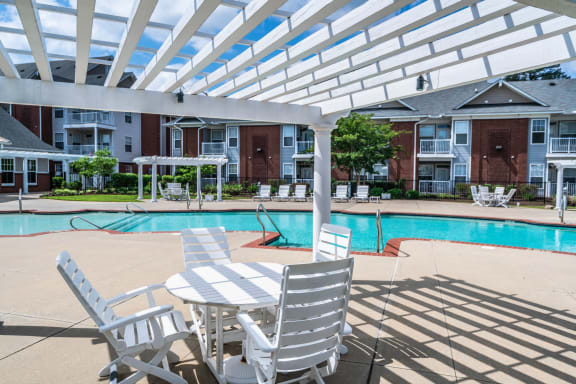 our apartments offer a swimming pool with patio furniture