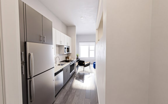 Kitchen No backsplash quartz at Link Apartments&#xAE; Mint Street, Charlotte, 28203