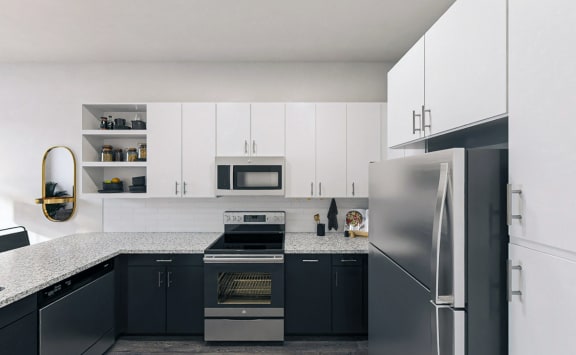 Kitchen with appliances at Link Apartments&#xAE; Broad Ave, Memphis