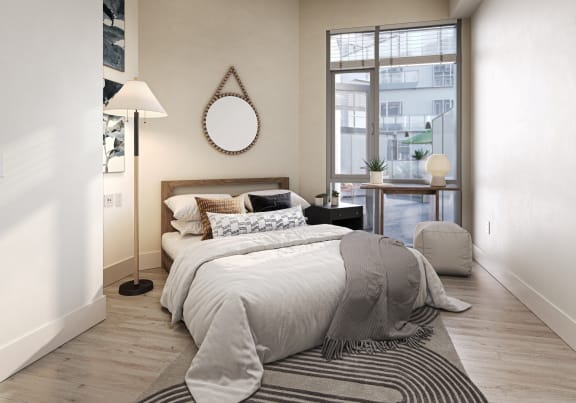 a bedroom with a bed and a window at Link Apartments® Four 12, Oakland