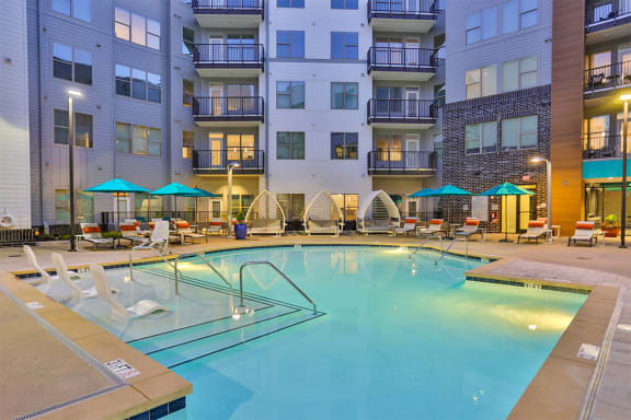Large pool with lap lane and social areas  at Link Apartments® Montford, Charlotte, NC