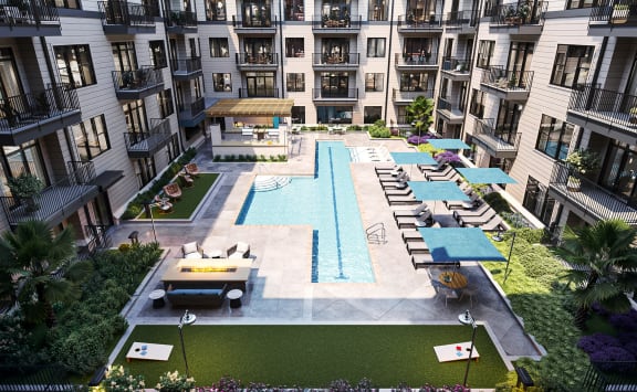 Huge Saltwater pool, lap lane, fire pit, cornhole, grills and lounge areas at Link Apartments Montford Phase 2 in Charlotte, NC