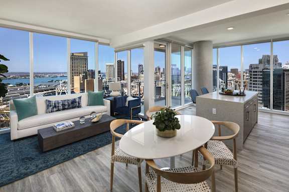A modern living room with a view of the city skyline.
