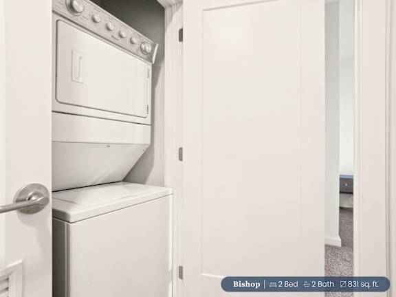 A white oven and toilet are in a small room.