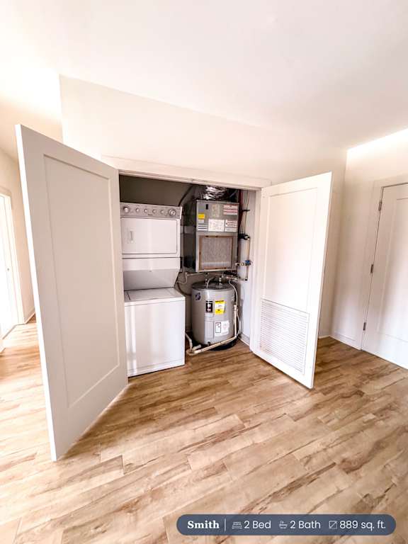 A small room with a white door open to a kitchen area.