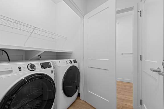 A laundry room with a washer and dryer.