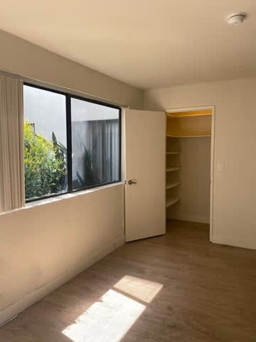 A room with a door and a window.