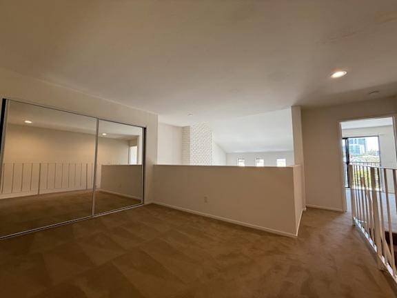 Empty room with a sliding door and a window.