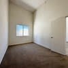 A room with a window and a door.
