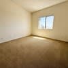 A room with a window and no furniture.