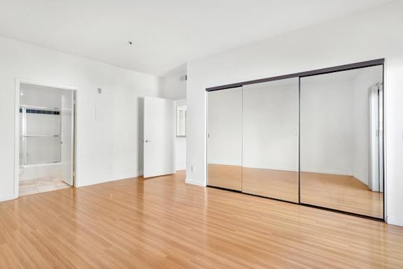 A room with wooden floors and white walls.