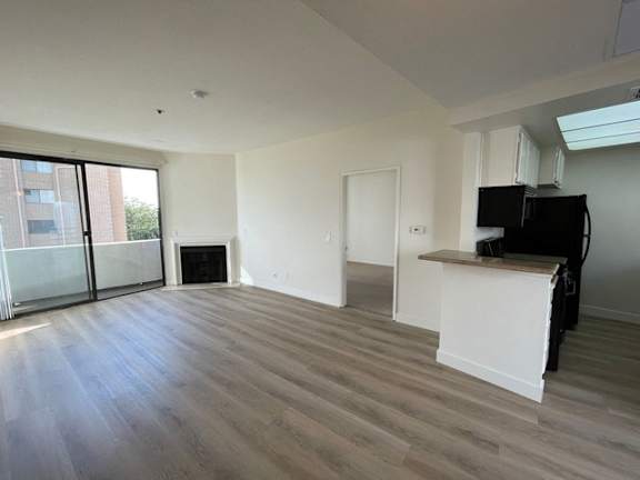 A living room with a fireplace and a television.