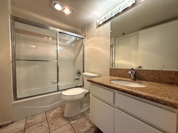 A bathroom with a toilet, sink, and shower.