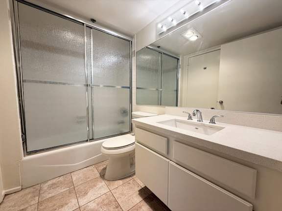 A bathroom with a toilet, sink, and shower.