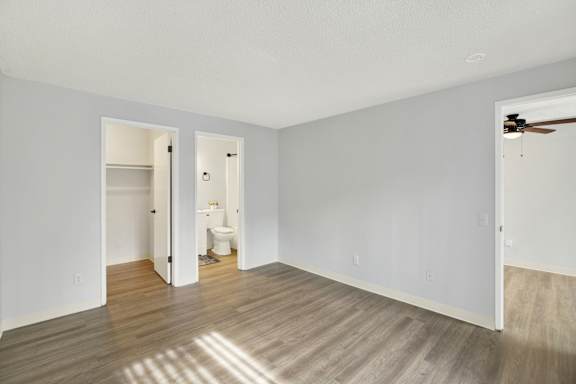 A room with a wooden floor and white walls.