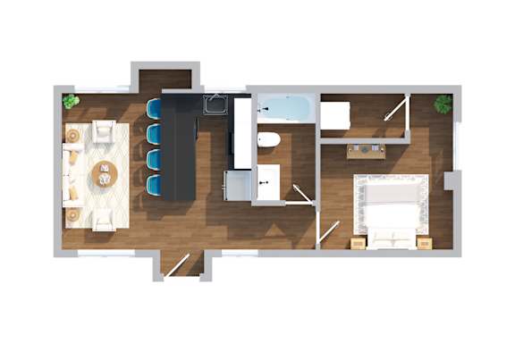 Floor Plan  A top-down view of a room with a couch, chairs, a dining table, and a kitchenette.