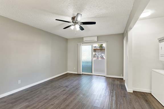 A room with a ceiling fan and wooden flooring.at Federal Apartments, Los Angeles, CA 90025