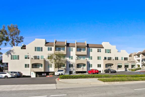 A large building with a parking lot in front of it.