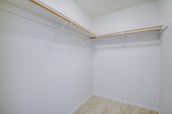 a walk in closet with white walls and gray carpet  at Seville at Gale Ranch, San Ramon, CA