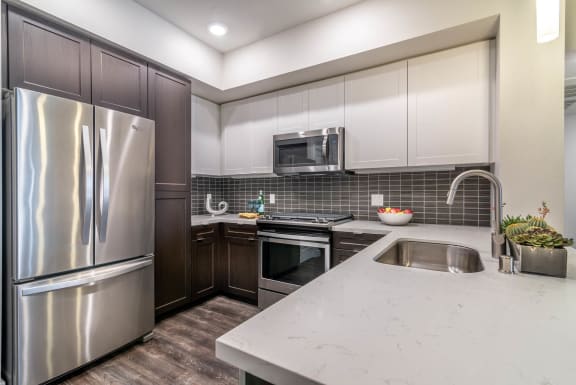 the kitchen in a bedroom plus den unit.