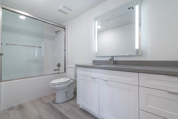 a bathroom with a sink toilet and shower  at Montecito Apartments at Carlsbad, Carlsbad, CA, 92010