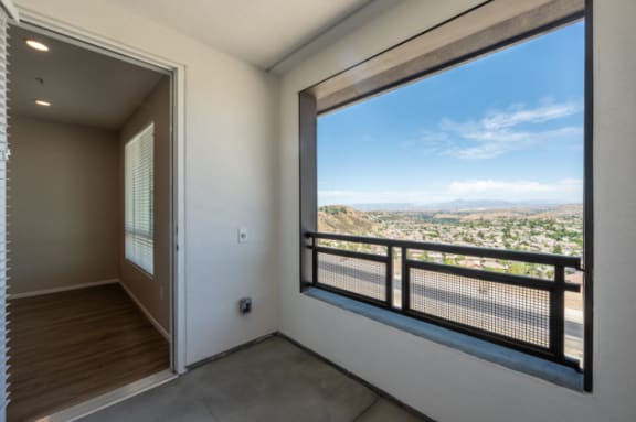 a view of the valley from a living room with a large window at The Overlook Santa Clarita, California