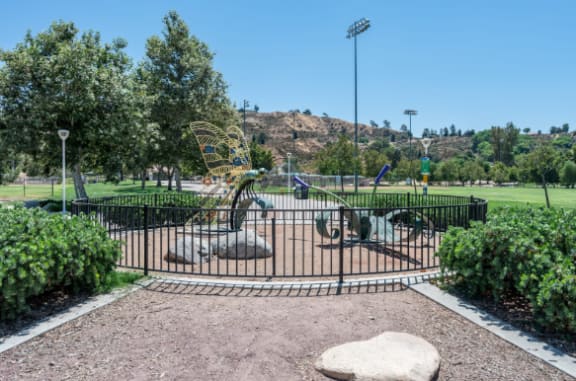 a park with a playground and a fence at The Overlook Santa Clarita, California