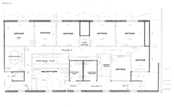 A floor plan of an office building with multiple office spaces and a reception area.