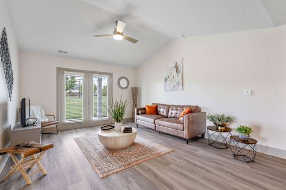 a living room with a couch and a coffee table at Morada at Maysville Apartments, Fort Wayne, IN, 46815
