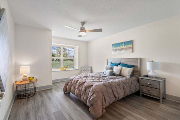 a bedroom with a bed and a ceiling fan at Morada at Maysville Apartments, Fort Wayne