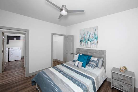 a bedroom with a bed and a ceiling fan at Ritchey Reserve Apartments, Fishers, IN
