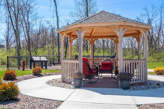 a gazebo with a table and chairs at Ritchey Reserve Apartments, Fishers