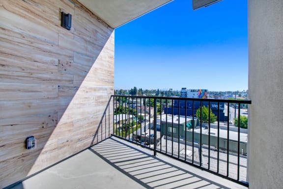 a balcony with a view of the city