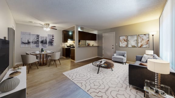 our apartments offer a living room and dining room with a table and chairs