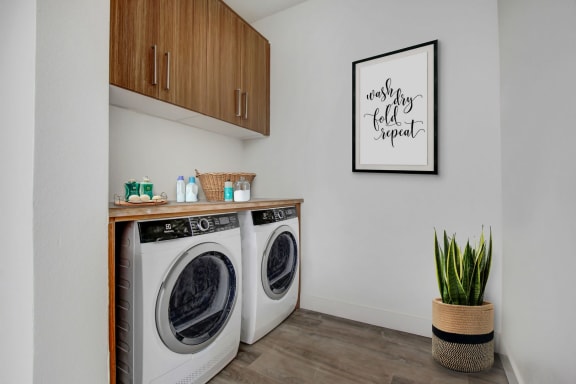 a laundry room with a washer and dryer