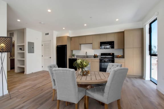 a kitchen and dining area in a 555 waverly unit