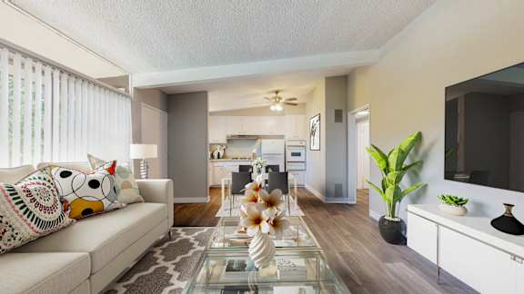 a living room with a couch and a glass table