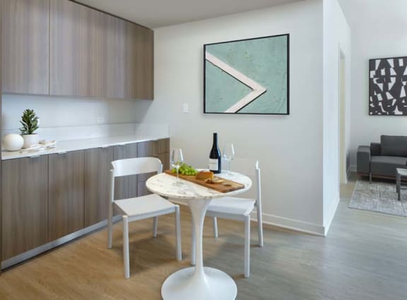 a small dining room with a table and chairs