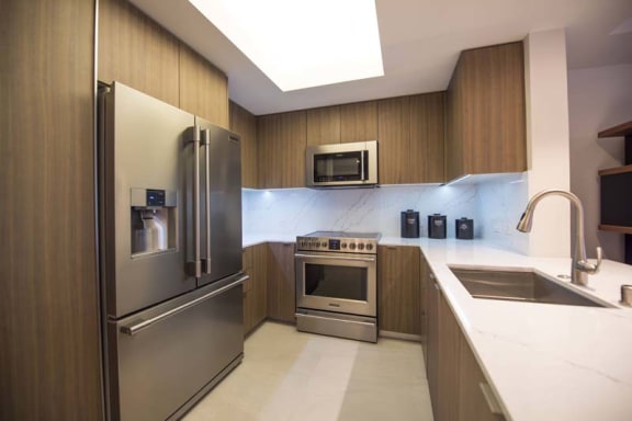 a kitchen with stainless steel appliances and a sink
