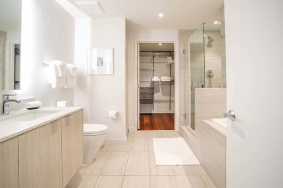 a bathroom with a toilet a sink and a shower