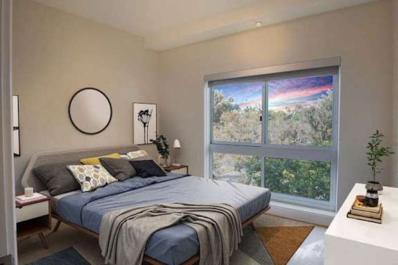 a bedroom with a bed and a large window a bedroom with a bed and a large window at Wilshire Margot, Los Angeles California