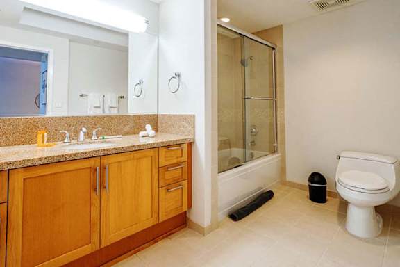 a bathroom with a sink toilet and a shower a bathroom with a sink toilet and a shower at Wilshire Margot, California, 90024