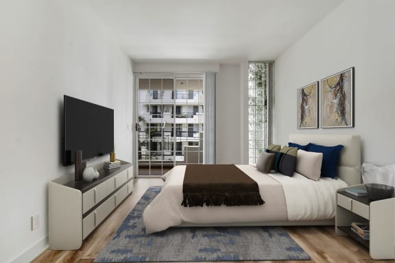 a bedroom with a large bed in front of a window