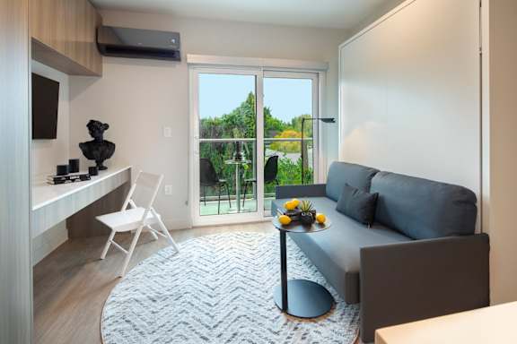 Living Area With Balcony at The Aster, Los Angeles, CA, 90024