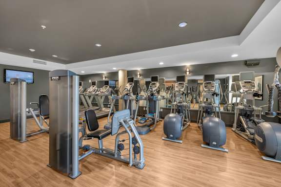 Fitness center with cardio and strength equipment at The Lyric Apartments, Seattle