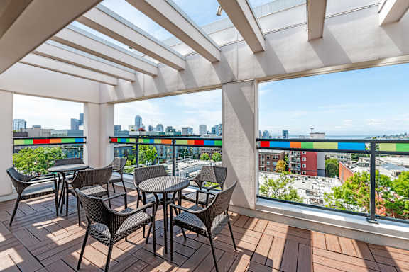 Rooftop patio with pergola and city views at The Lyric Apartments, Seattle, Washington