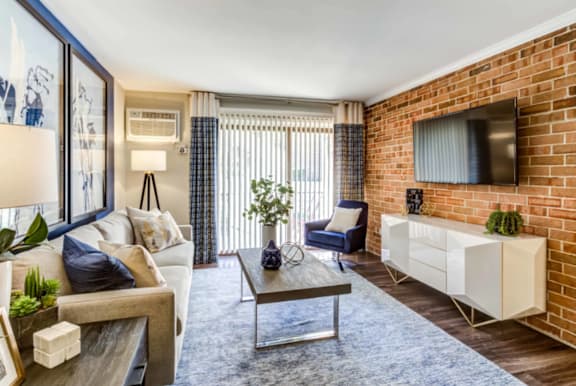 Living room with a white sofa at fifty9 Grove Apartments, Illinois