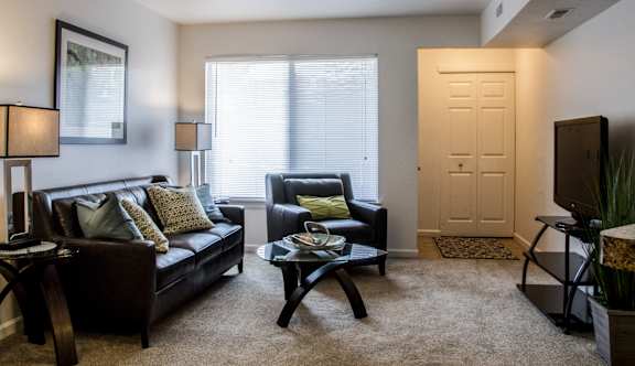 Living Room with Television at Pine Ridge Apartments, Michigan